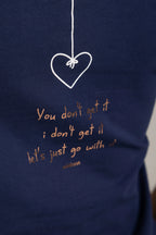 CAMISETA CORAZÓN COLGADO